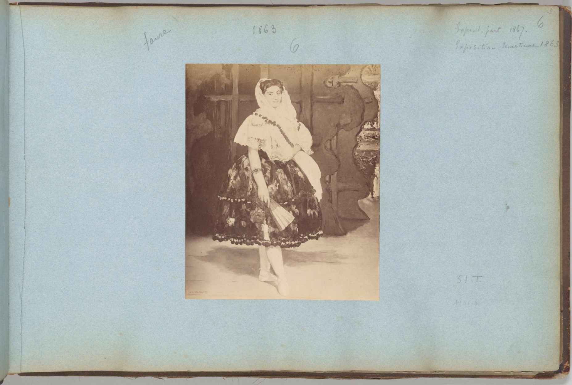 “Albumen photograph of Manet’s painting, Lola de Valence mounted on the blue pages of an album with annotations.”